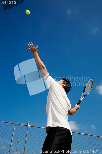 Image of Asian playing tennis