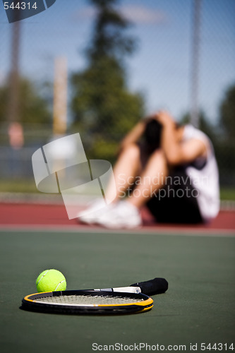 Image of Sad tennis player after defeat