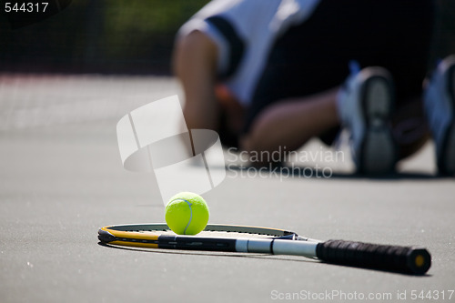Image of Sad tennis player after defeat