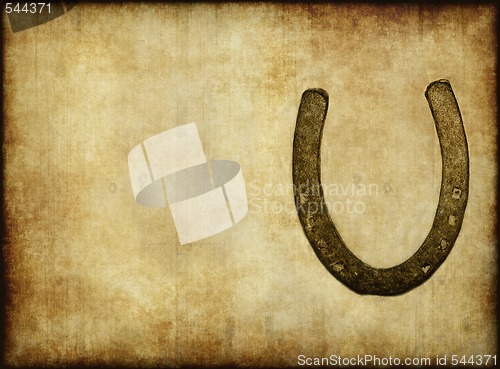 Image of old horseshoe on paper or parchment