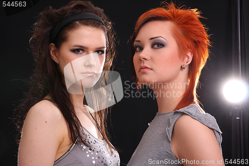 Image of Two models in colorful setting in the studio