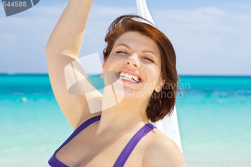 Image of happy woman with white sarong