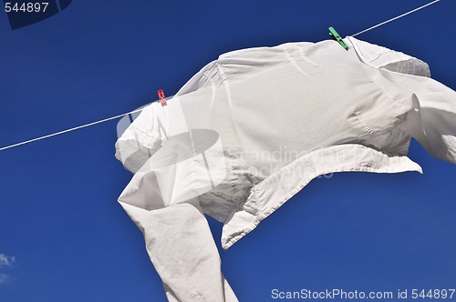 Image of White shirt on clothes line