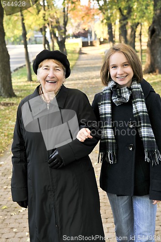 Image of Granddaughter walking with grandmother