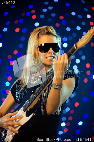 Image of Female guitar player