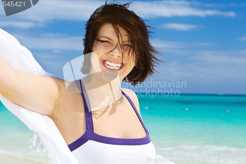 Image of happy woman with white sarong