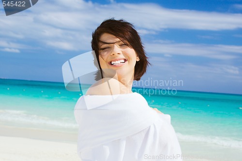 Image of happy woman with white sarong