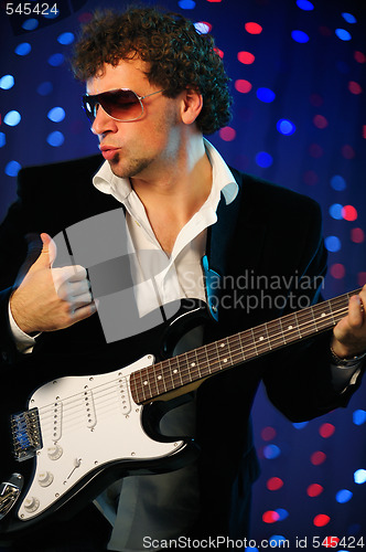 Image of male guitar player