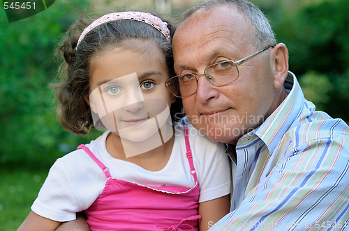 Image of Grandfather and kid outdoors