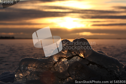 Image of Sunset over frozen lake