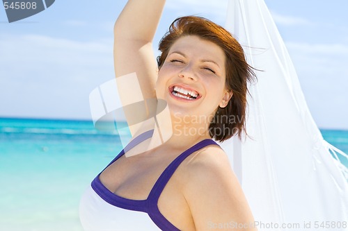 Image of happy woman with white sarong