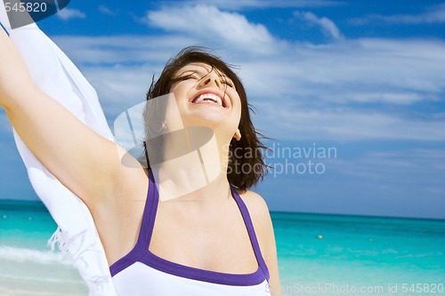 Image of happy woman with white sarong