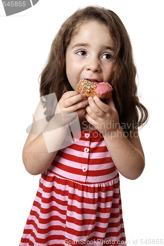 Image of Young girl eating doughnut