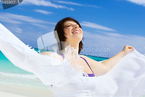 Image of happy woman with white sarong