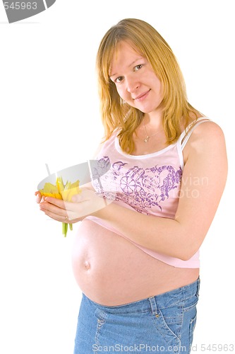 Image of pregnant woman with yellow flowers