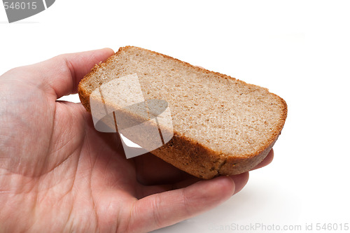 Image of Piece of the pumpernickel in hand