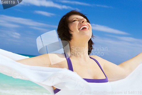 Image of happy woman with white sarong