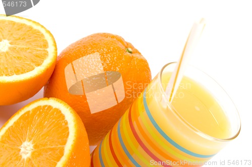 Image of glass of juice and oranges