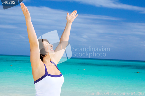 Image of happy woman on the beach