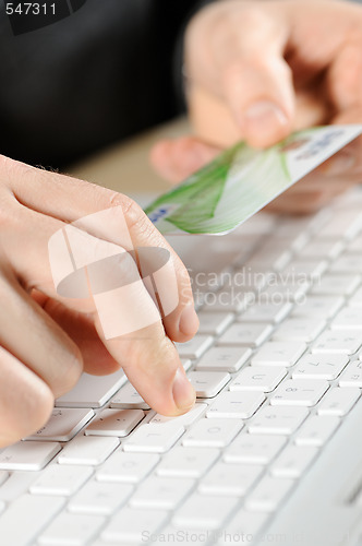 Image of male hands typing