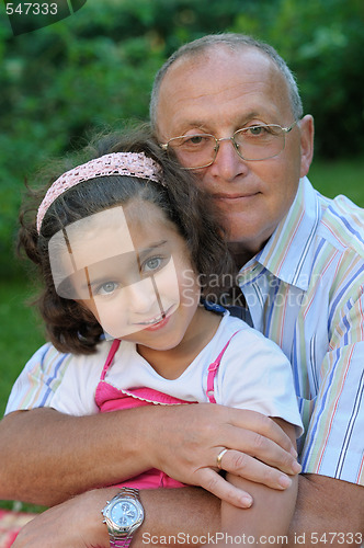 Image of Happy grandfather and kid outdoors