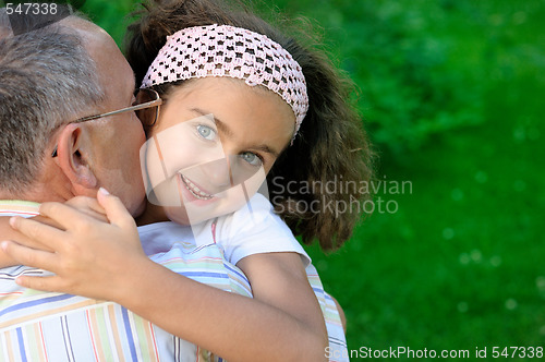 Image of Grandfather and kid outdoors