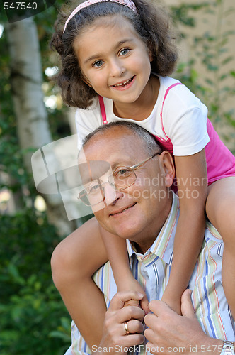 Image of Happy grandfather and kid outdoors