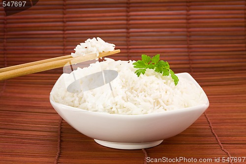 Image of Bowl of rice on mat