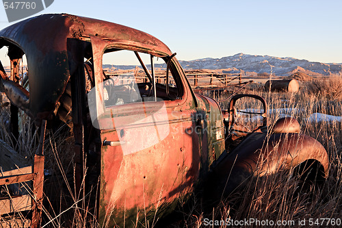 Image of abandoned car in field