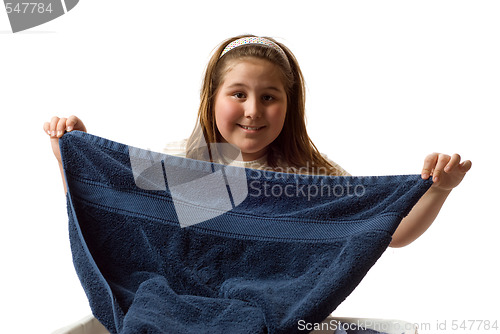 Image of Girl Folding Towels