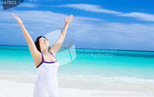 Image of happy woman on the beach