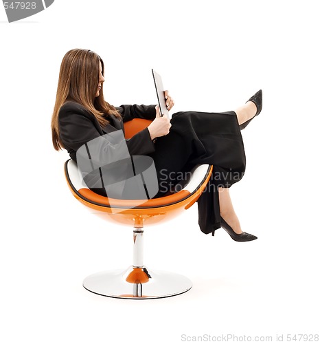 Image of businesswoman in chair with laptop