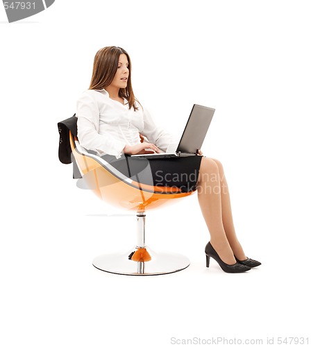 Image of businesswoman in chair with laptop