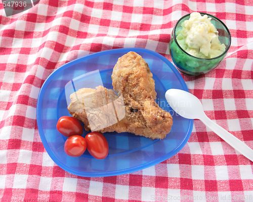 Image of fried chicken legs with potato salad