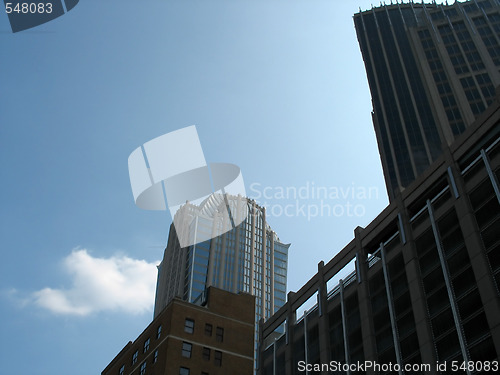 Image of buildings over blue