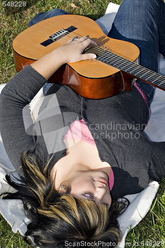 Image of Girl Playing a Guitar