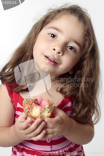 Image of Smiling girl eating snack