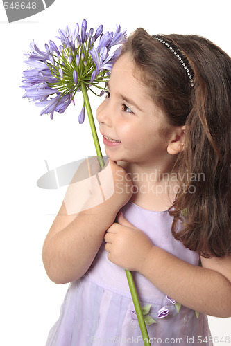 Image of Pretty girl holding a beautiful flower