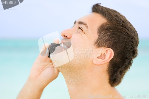 Image of happy man with cell phone