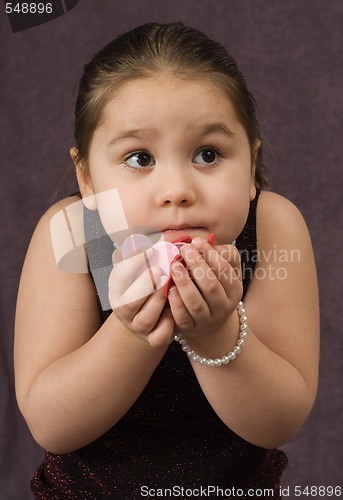 Image of Child Holding Heart Pieces