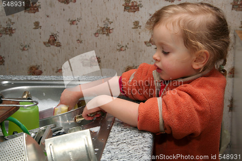 Image of Washing the dishes