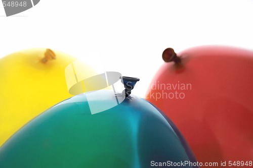 Image of blue, yellow and red balloons