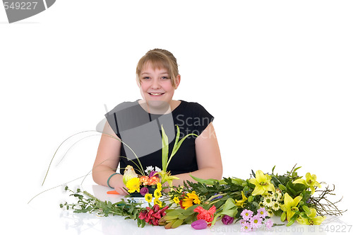 Image of Young girl arranging flowers 