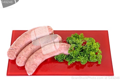 Image of Sausages on red plate