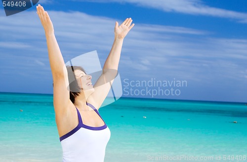 Image of happy woman on the beach