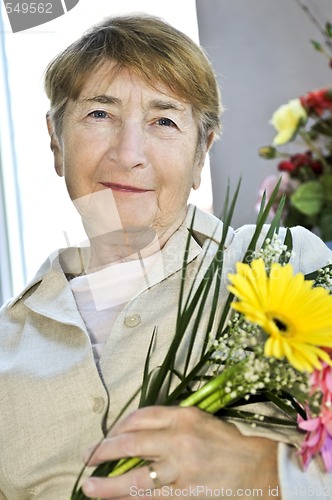 Image of Elderly woman with flowers