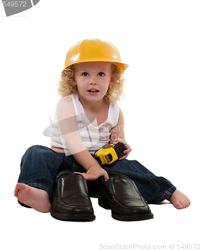 Image of Little boy with grown up man shoes