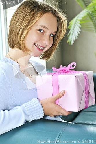 Image of Teenage girl with present