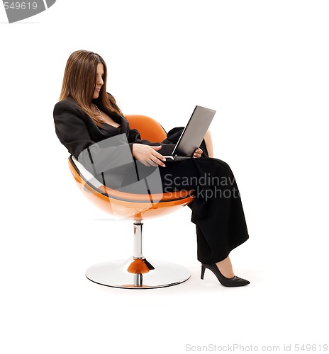 Image of businesswoman in chair with laptop