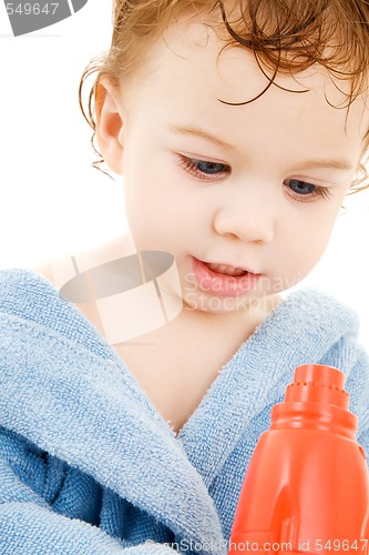 Image of baby boy with toy hair dryer